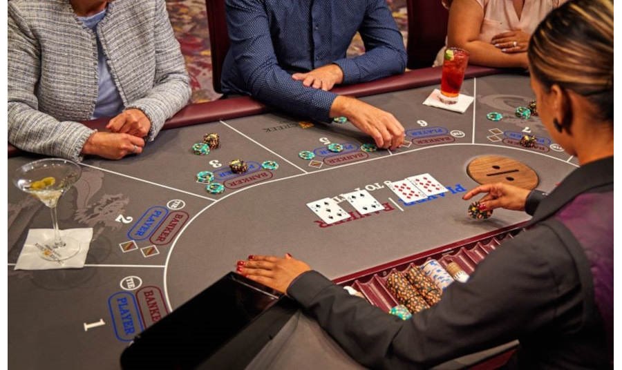 people at a baccarat table